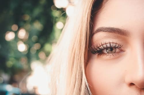 woman with beautiful eyelashes - best eyelash extensions for mature eyes