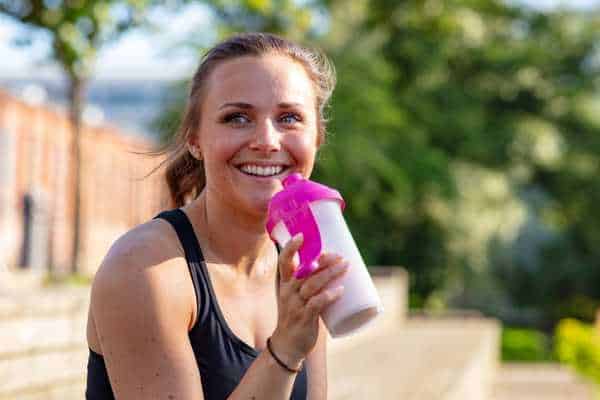 athlete drinking protein shake