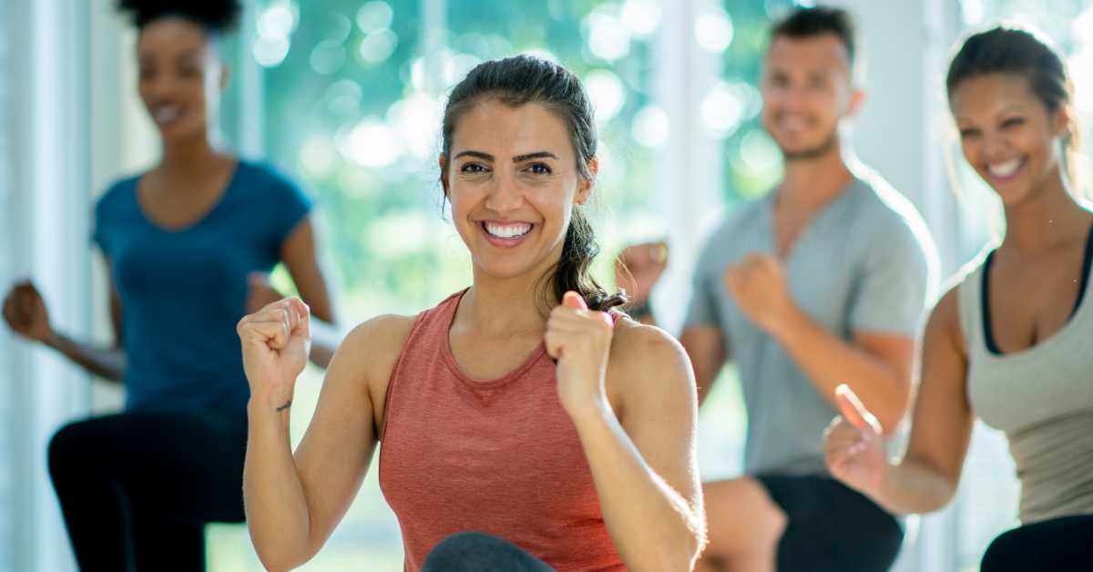 Return to Exercise After a Long Hiatus. Athletes in a group exercise class.