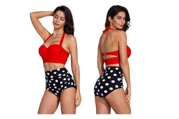 model wearing AMOURRI Vintage Polka High-Waist Swimsuit, featuring wide straps and underwire bikini top