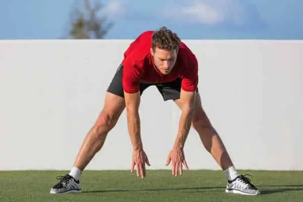 athlete demonstrating bum exercises to get a bigger bum.
