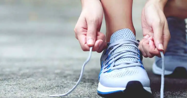 Runner tying shoe. get better at running without running