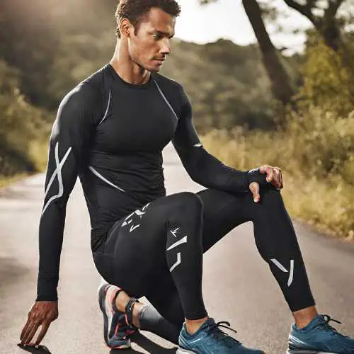 athlete wearing 2XU Ignition Compression Long Sleeve. Best Compression Shirts for Winter Running
