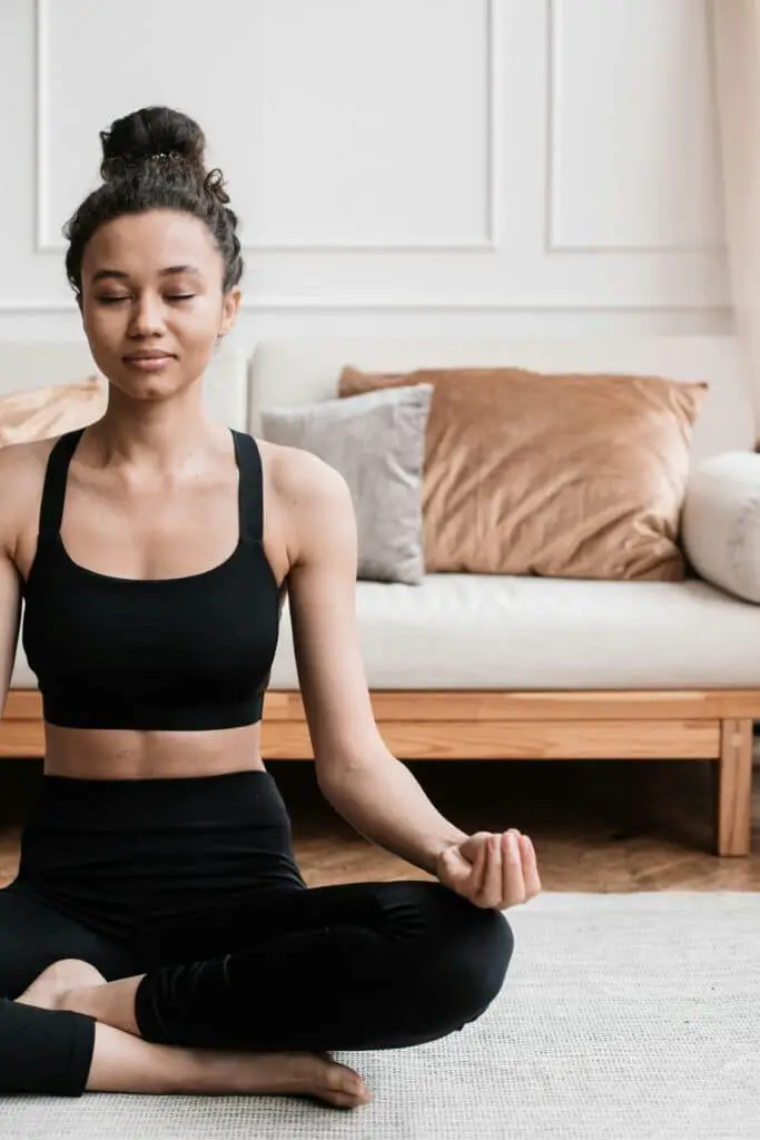 woman performing yoga poses in leggings
