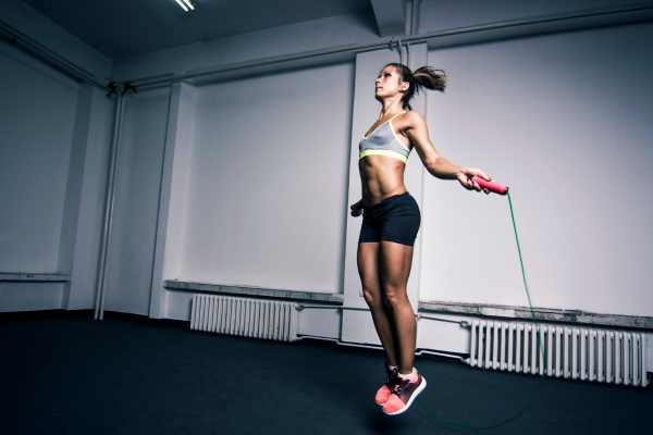 female athlete jumping rope fitness training
