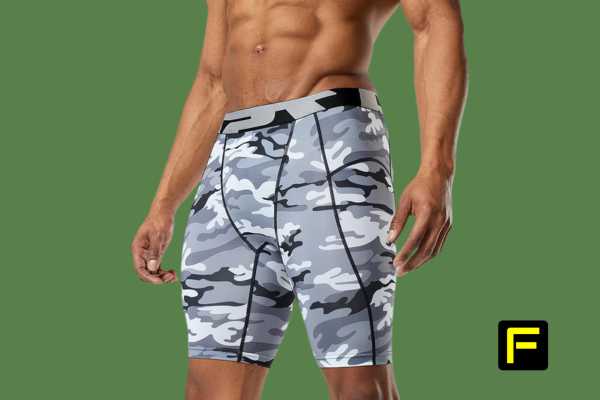 what are compression shorts made of? model wearing camo compression shorts against a green background