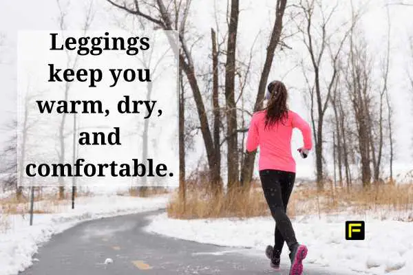 Woman running in the winter with snow on the ground