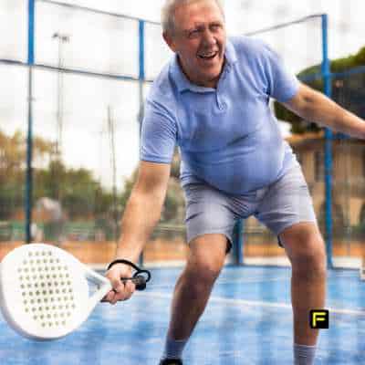 Active senior playing pickleball, showcasing strength and mobility—highlighting the benefits of creatine for age-related muscle loss and preventing sarcopenia.