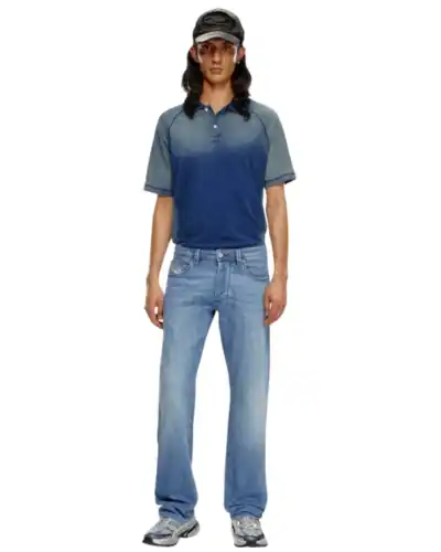 11 Best Jeans for Men with Big Butts: Finding Your Perfect Fit 12 Model wearing Diesel Larkee Relaxed Fit with a dark polo shirt and ball cap.