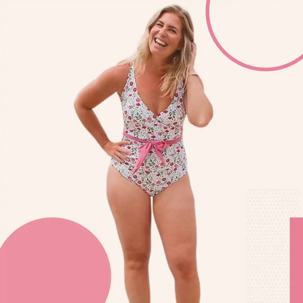 Woman wearing SwimZip UPF 50+ ruched swimsuit with cross-front design providing sun protection and tummy control