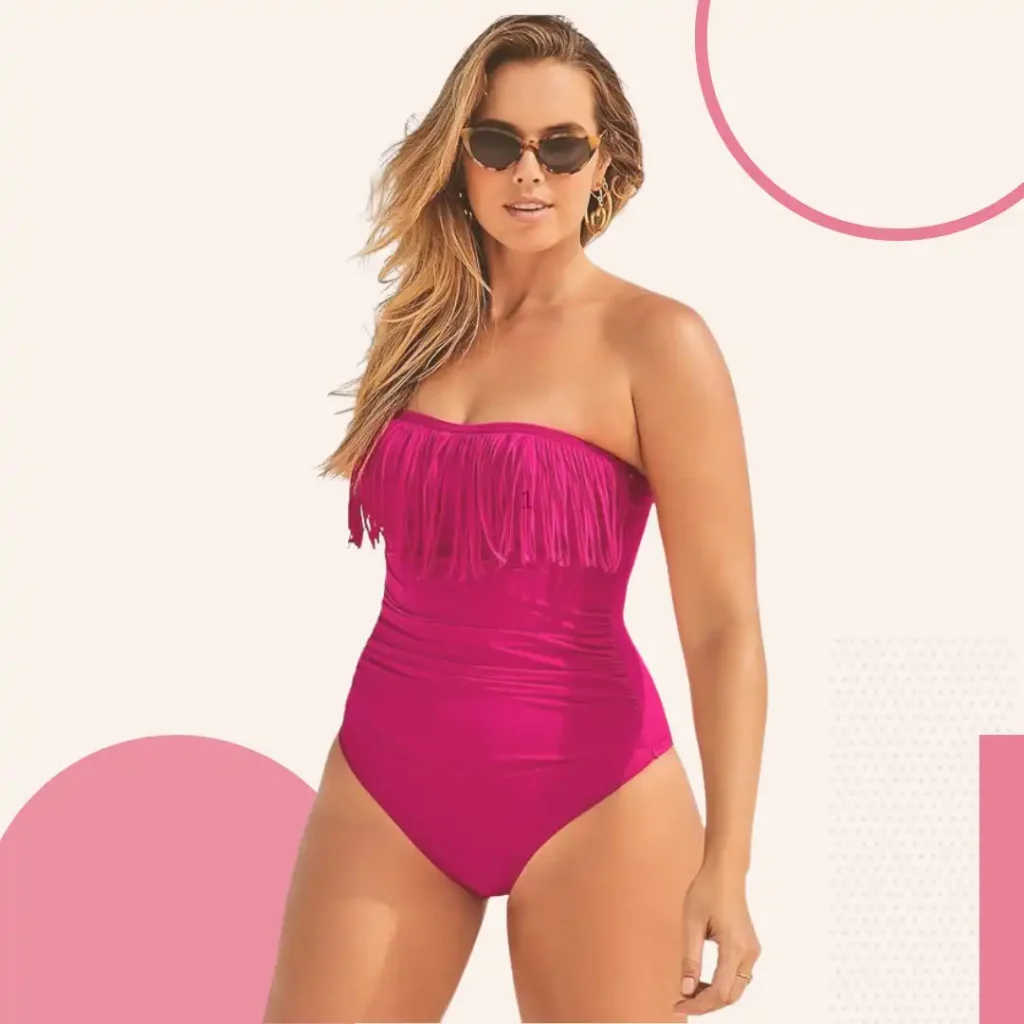 Plus size woman in Swimsuits For All strapless bandeau swimsuit with ruched bodice concealing tummy bulges